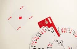 The deck of playing cards and a red credit card imitating a joker